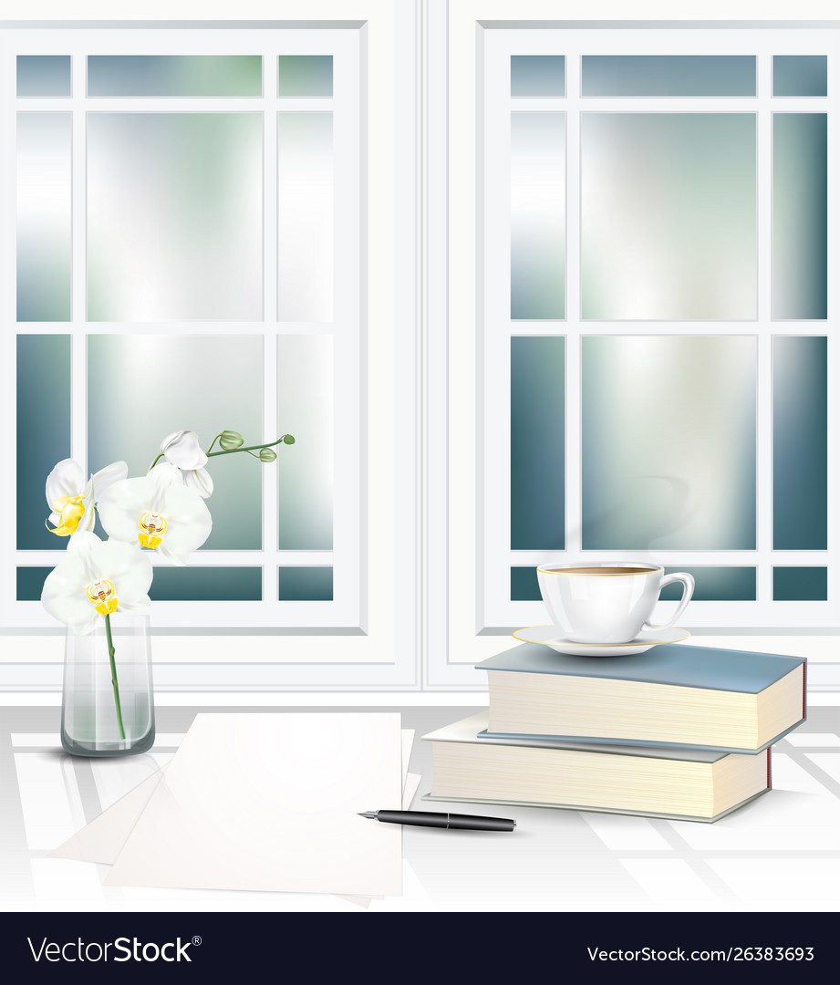 Tea cup and books on table beside window