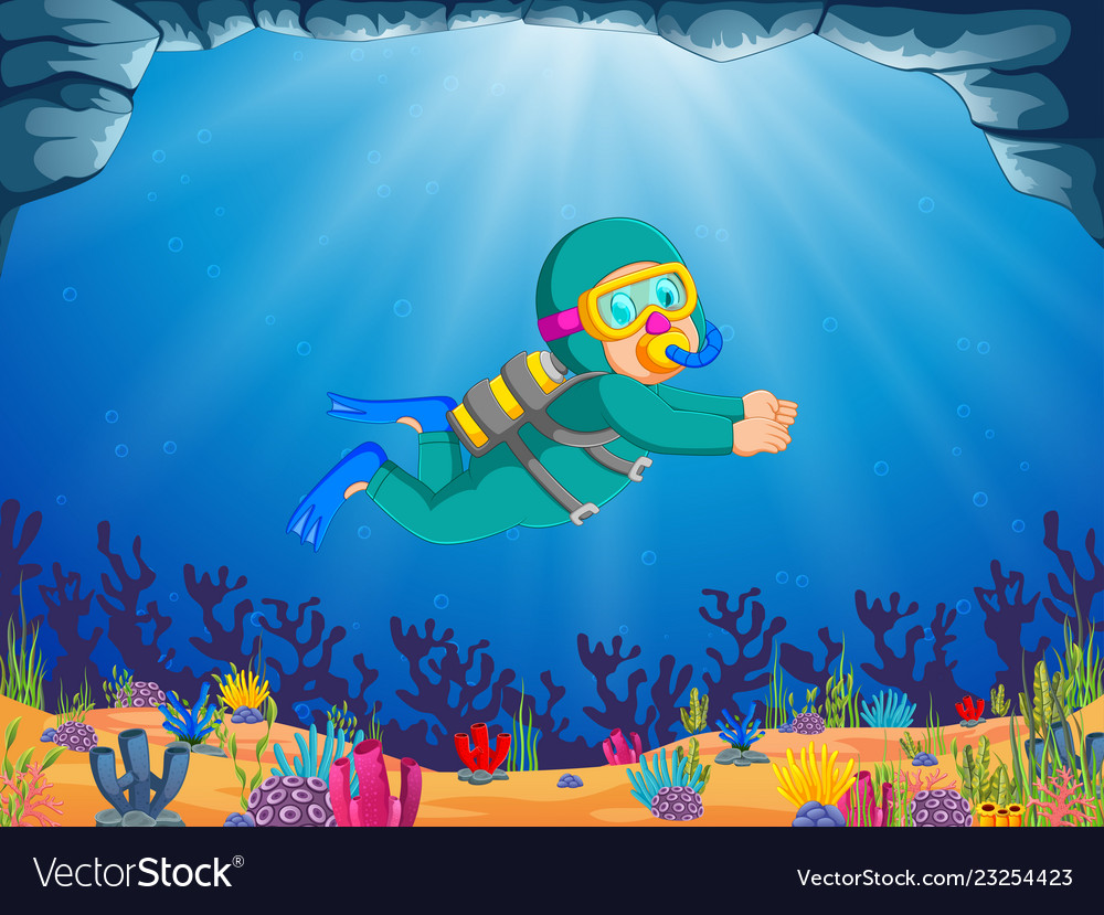 Professional boy is diving under the beautiful sea