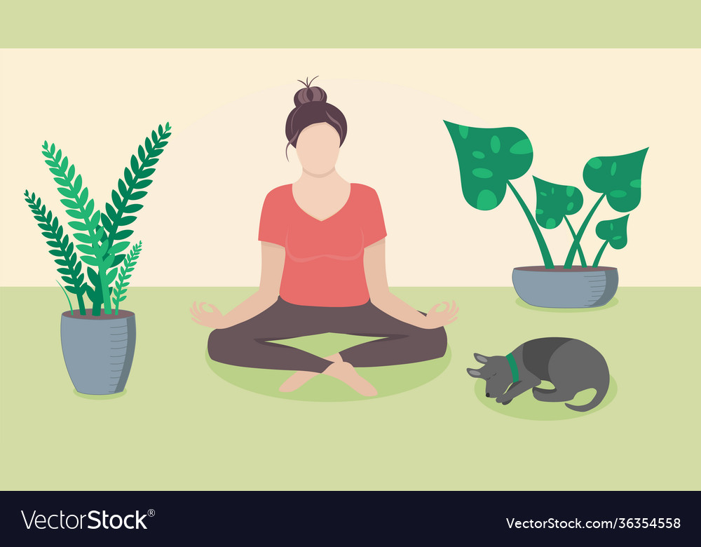 Woman meditating at home on floor with plants