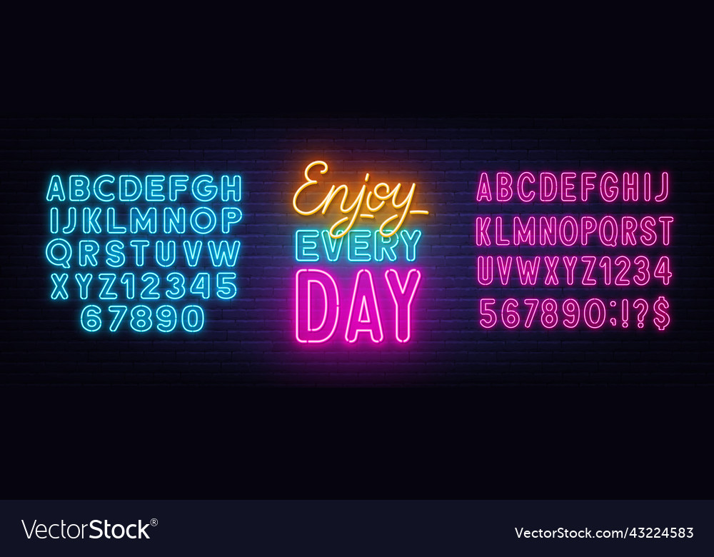 Enjoy every day neon quote on brick wall