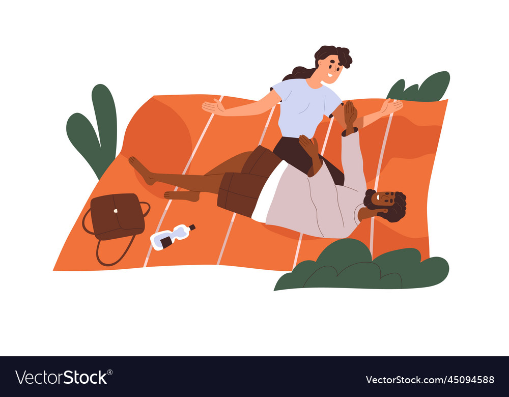 Love couple relaxing on picnic blanket summer