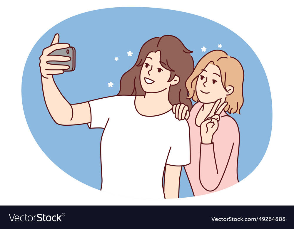 Smiling girls make selfie on smartphone