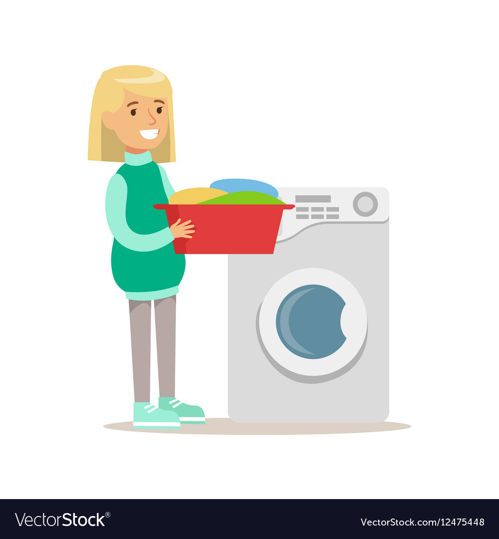 Girl loading washing machine with clothes smiling