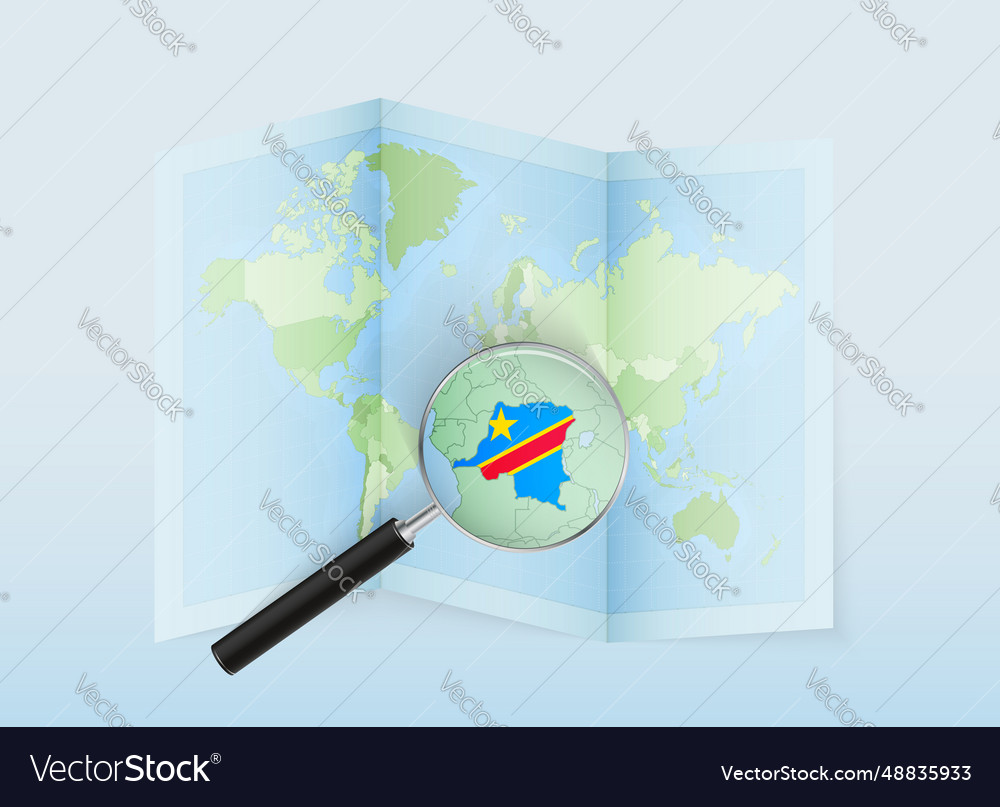 A folded world map with magnifying lens
