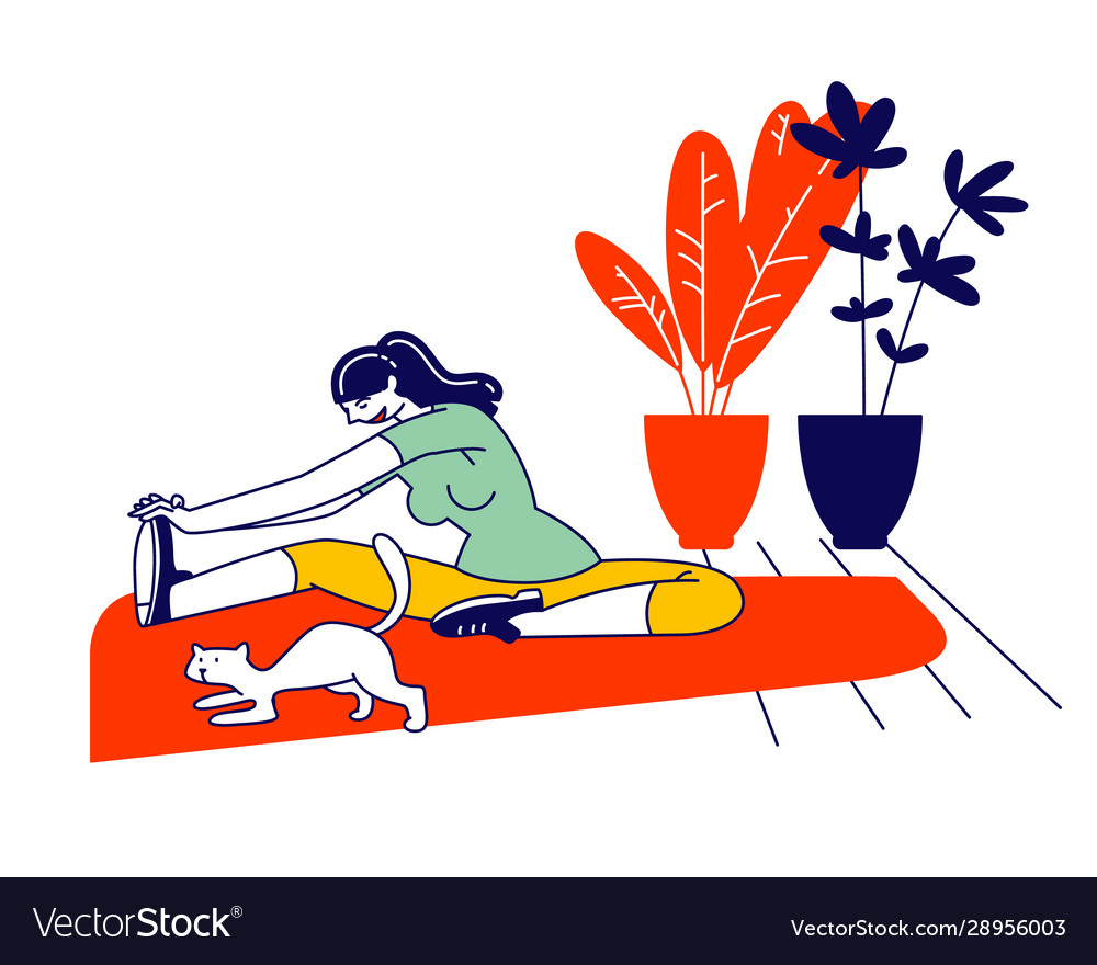 Young woman sitting on floor with cat in room