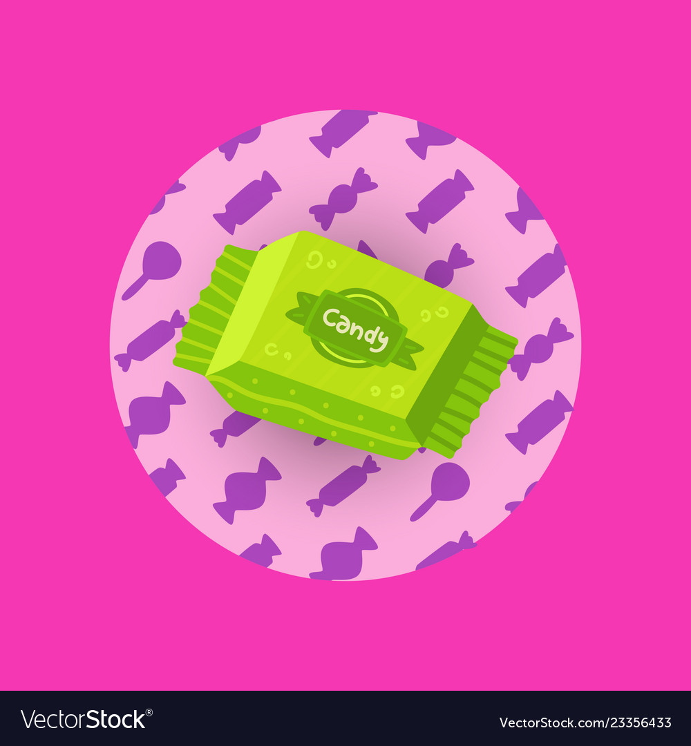 Candy in a green wrapper on pink background