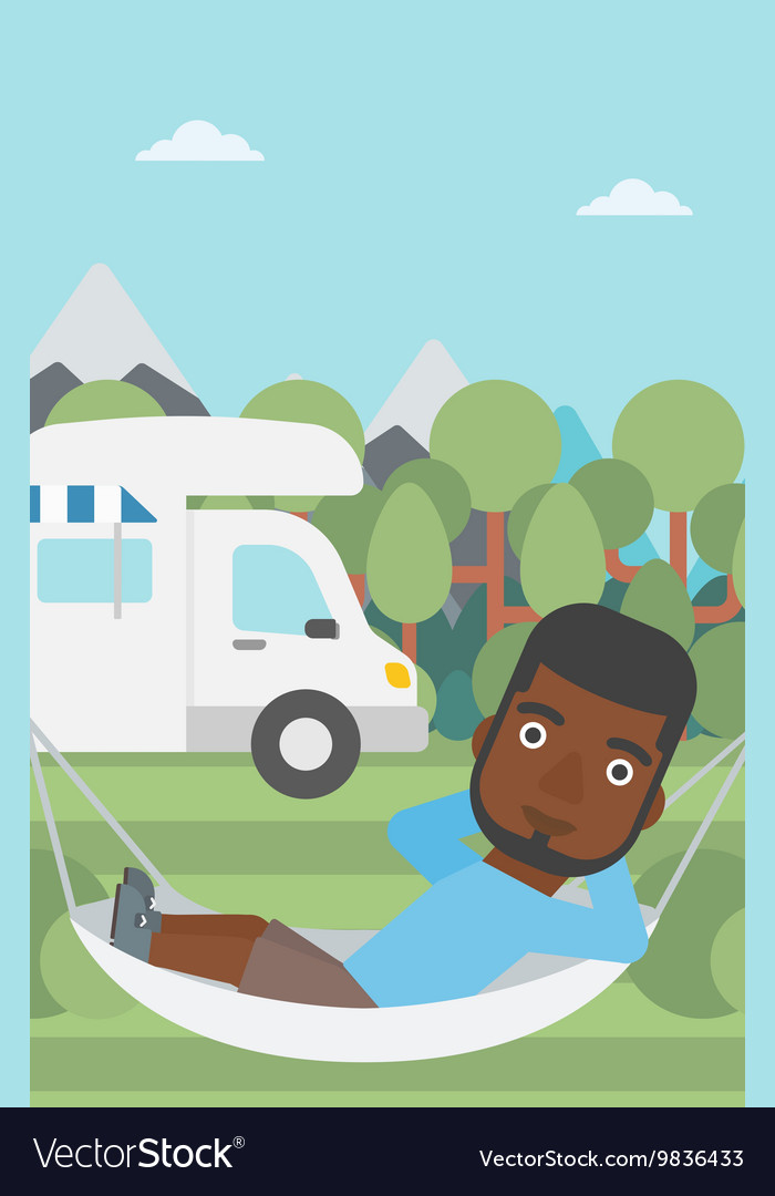 Man lying in hammock front of motor home