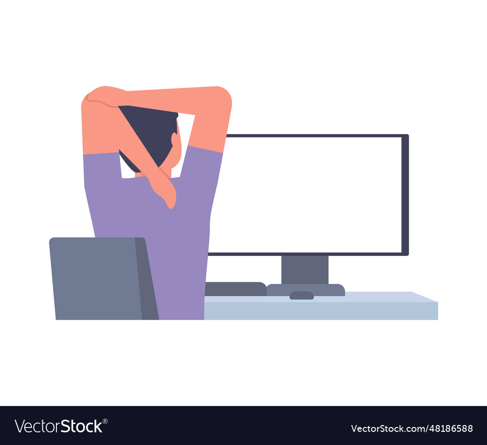 Man sits back at table computer and stretching