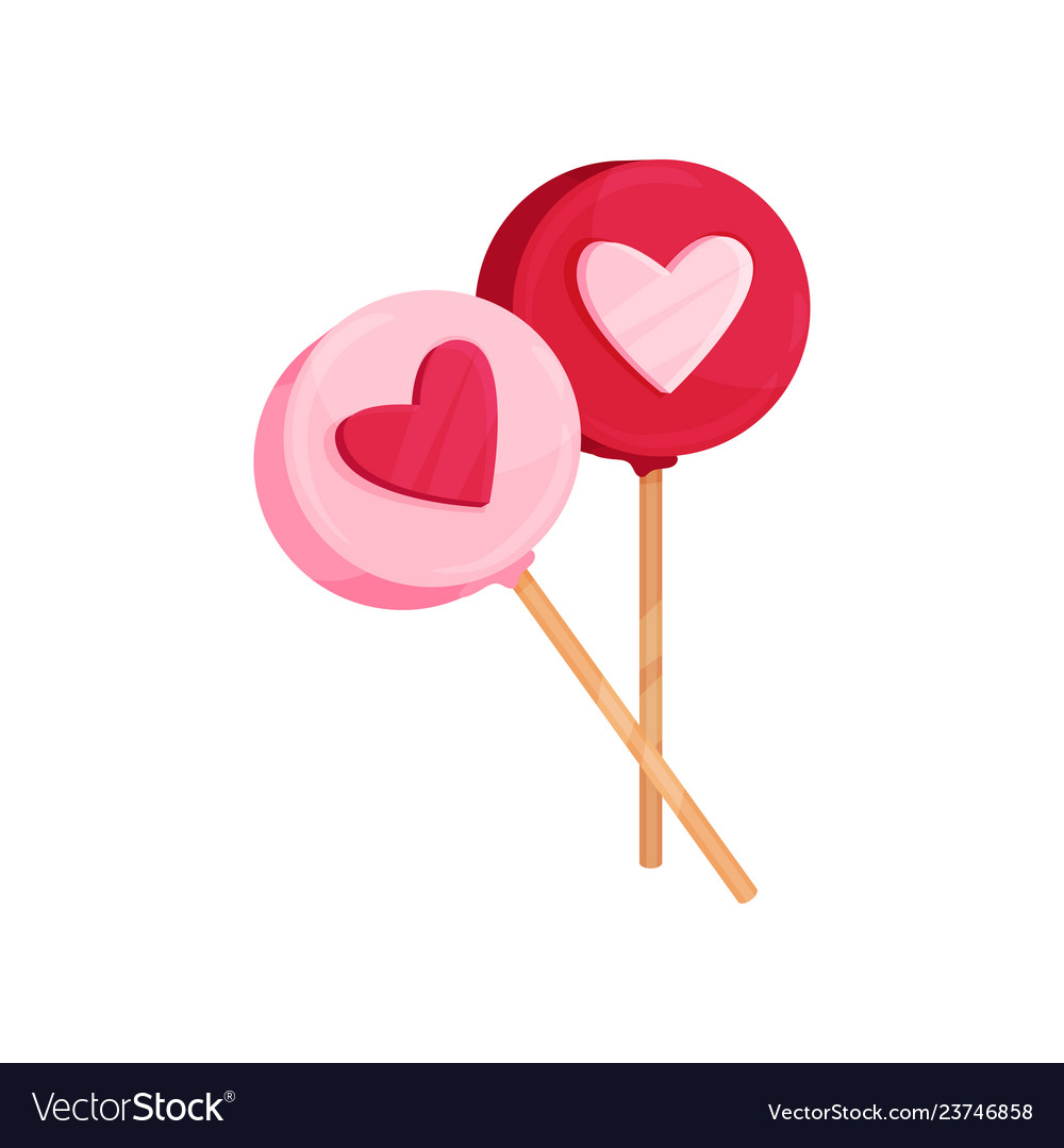 Two round lollipops with heart ornament candies