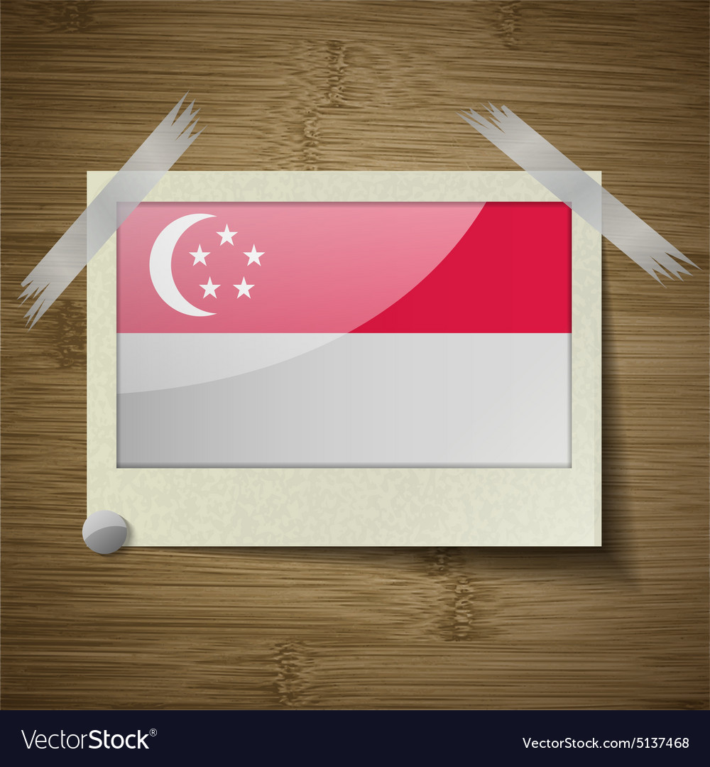 Flags singapore at frame on wooden texture