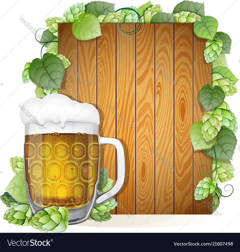 Beer mug and hops on a wooden background