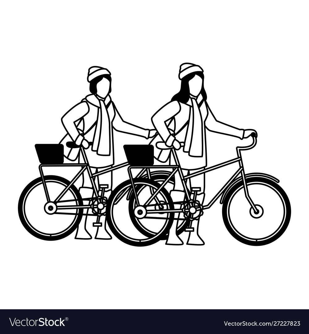 Happy young girls with autumn clothes in bicycle