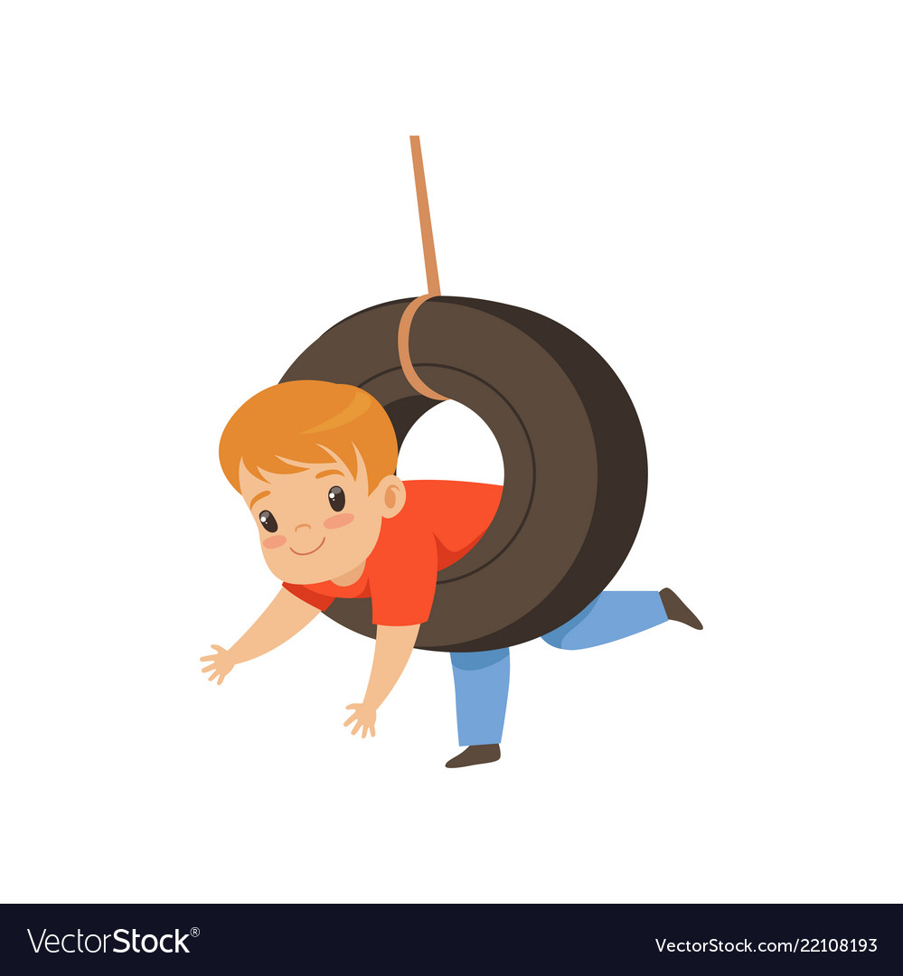 Cute boy riding swing made from tire little kid