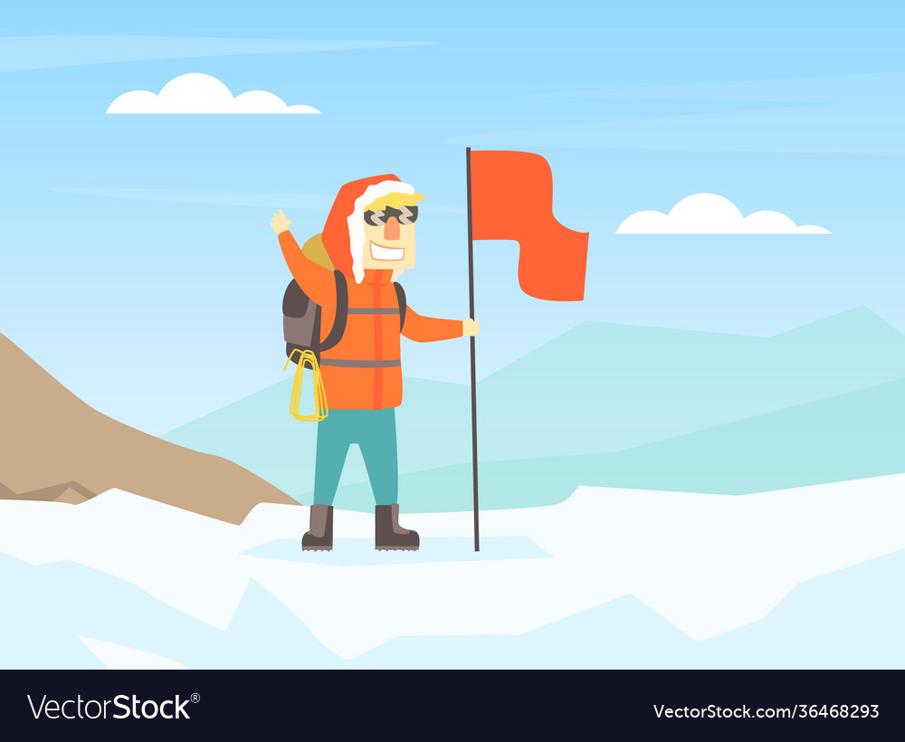 Climber standing on top mountain with flag