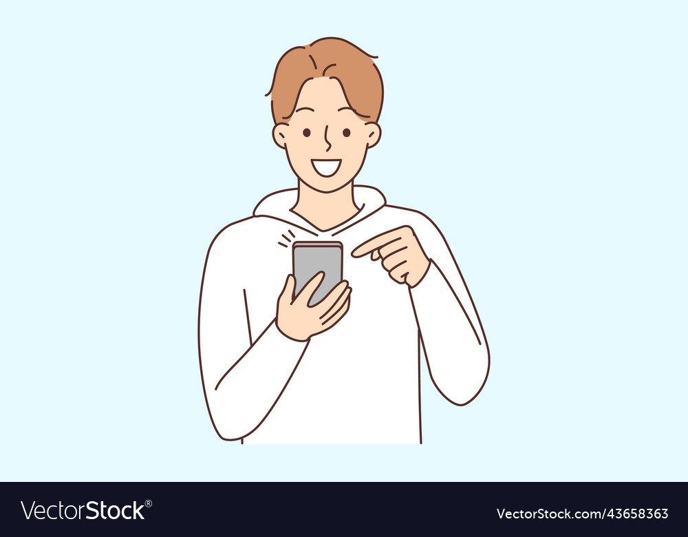 Smiling man using cellphone texting