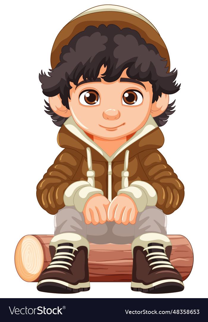 Cheerful boy in cartoon hoodie sitting on wooden