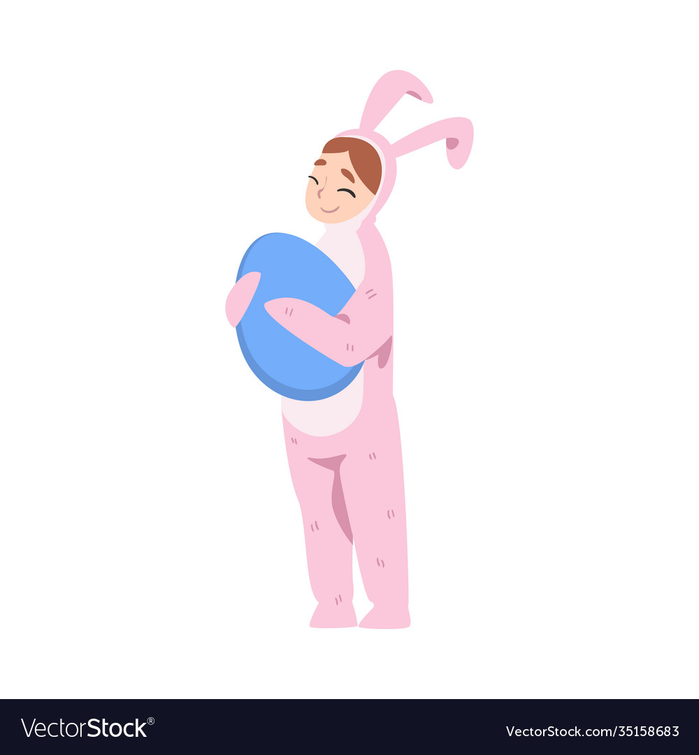 Girl wearing pink bunny costume holding big