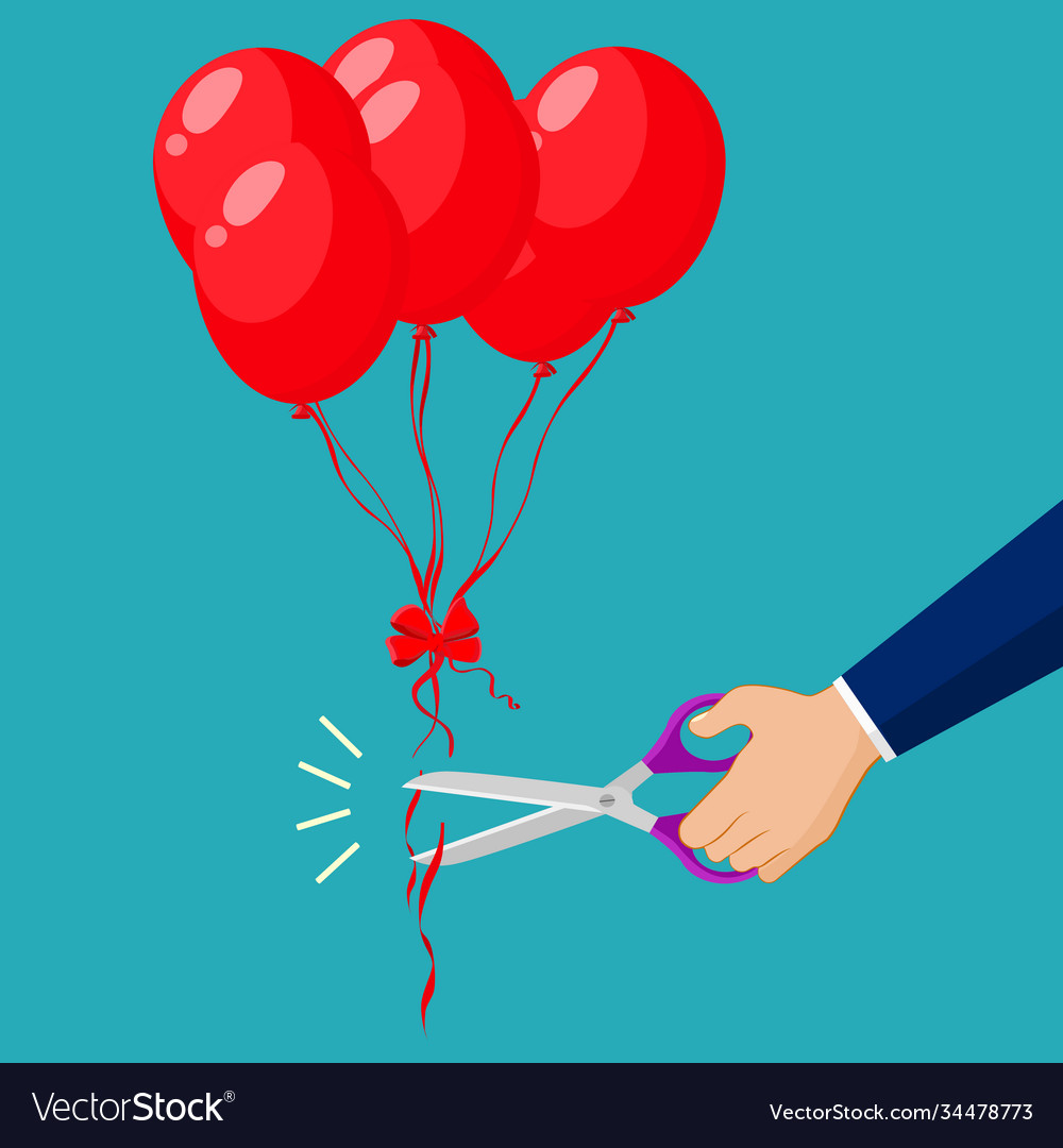 Hand cutting balloon string with scissors flat