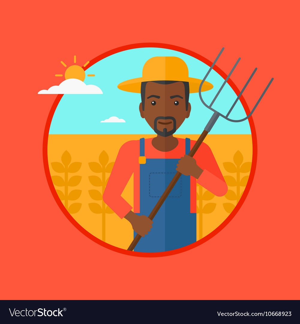 Farmer with pitchfork in wheat field