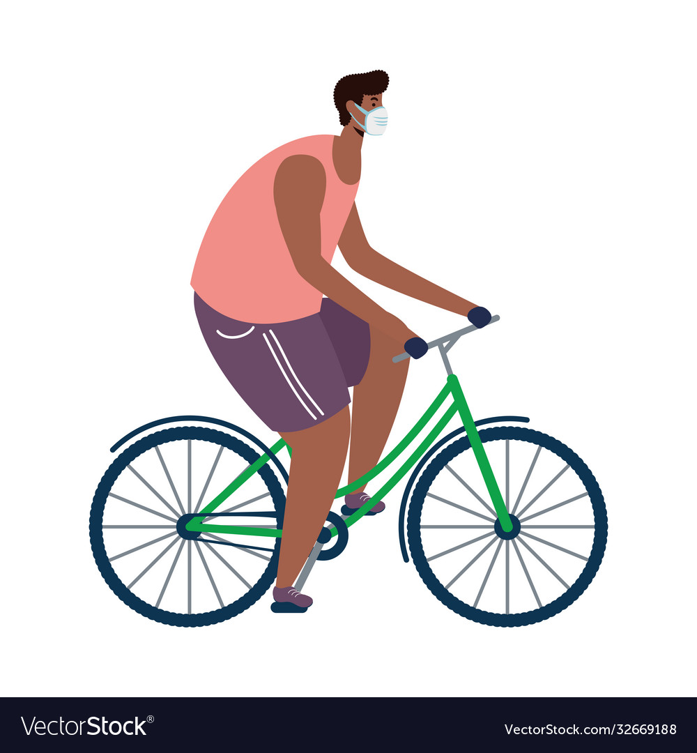 Young afro man wearing medical mask in bicycle