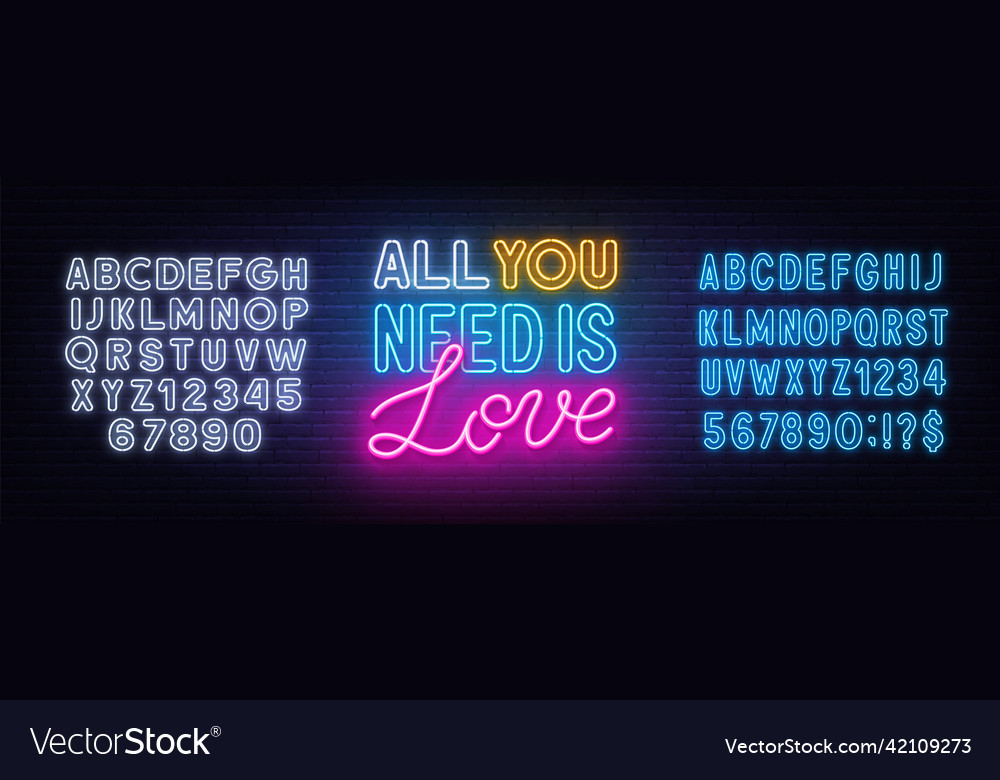 All you need is love neon lettering on brick wall