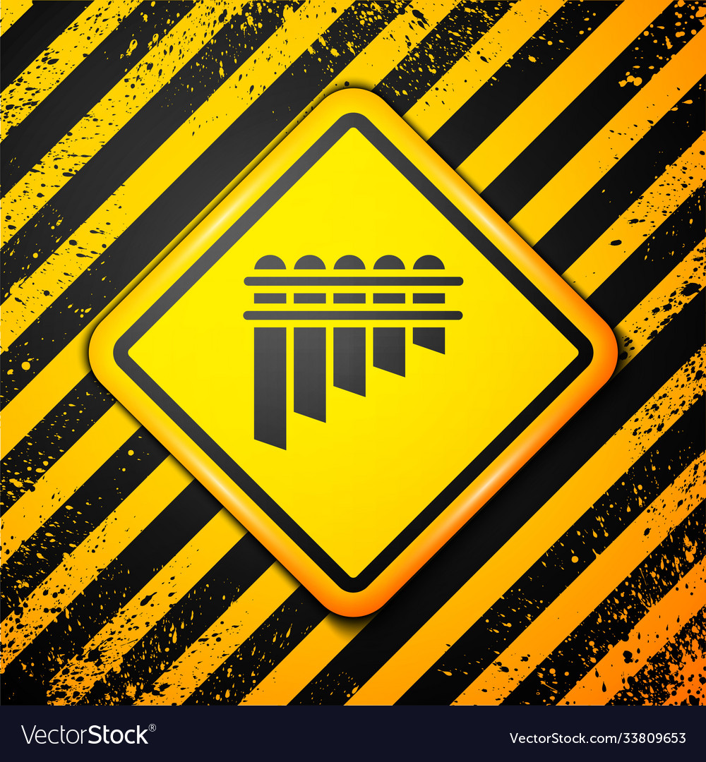 Black pan flute icon isolated on yellow background