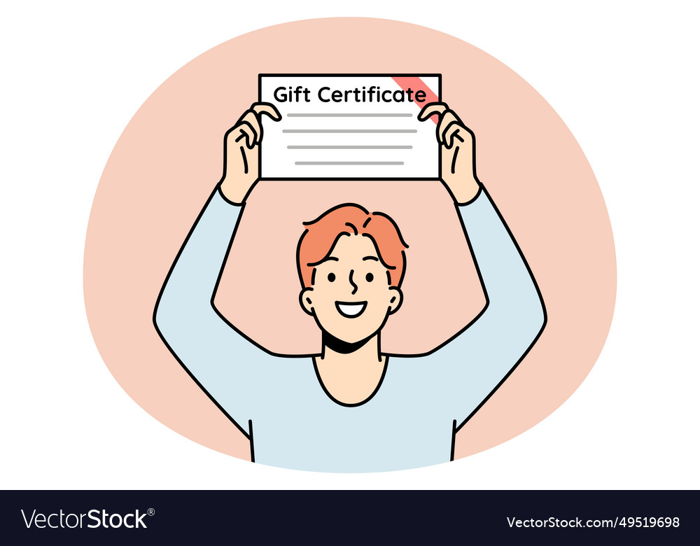 Smiling young man with gift certificate in hands