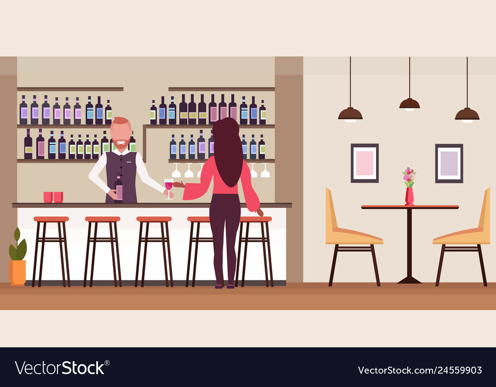 Woman standing at bar counter drinking alcohol