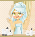 cute girl in turban from towel put a cream vector image vector image