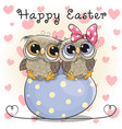 two cute owls are sitting on an egg vector image vector image