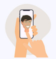 hand holding mobile smart phone with face vector image vector image
