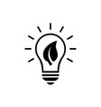 light bulb with leaf inside black icon vector image