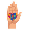 hand lifting puzzle heart vector image
