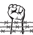 raised hand with clenched fist behind barbed wire vector image