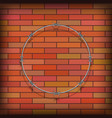 barbed wire circle on red brick background vector image