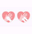 dog and cat paws on hand in heart shaped frame vector image
