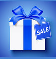 white gift box wrapped with blue ribbon and sale vector image