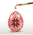 red decorative easter egg and paintbrush vector image vector image