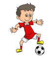 happy soccer boy is kicking the ball vector image vector image
