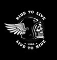 biker skull in helmet with wing on dark background vector image
