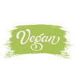 hand drawn lettering vegan on a paint brush stroke vector image