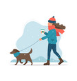 woman walking a dog in winter cute vector image vector image