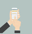 hand holding smartphone with rating or raking vector image
