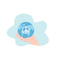 human hand holding globe of earth with hippie vector image