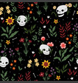 seamless pattern with skulls and flowers on a dark vector image