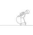 single continuous line drawing microphone in hand vector image