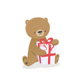 festive of baby bear cartoon with a gift happy vector image