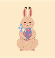 cute easter bunny with an egg graphics vector image vector image