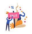 sale table placed by shop worker with leaves vector image