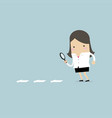 businesswoman searching through a magnifying glass vector image